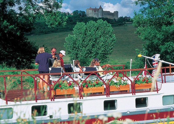 Passengers on the deck of the four-passenger ultra deluxe hotel barge Alouette