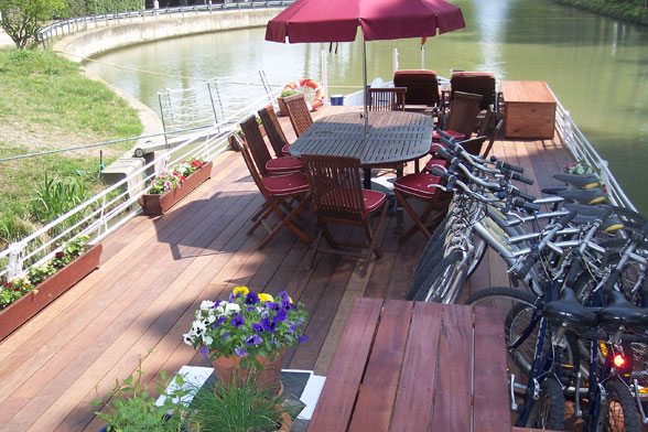 The deck of the Hotel Barge Athos, the perfect place to relax while cruising, and evenings before pre-dinner aperitifs.