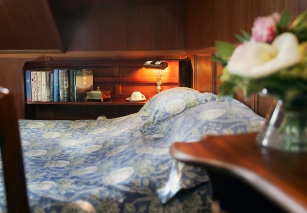 One of La Belle Epoque's cabins, configured with a queen bed.