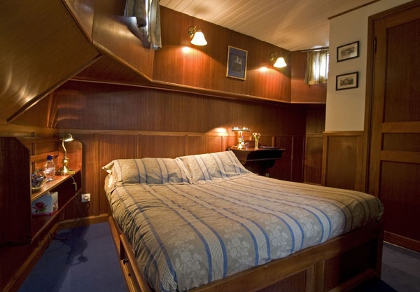 La Belle Epoque's Mersault Junior Suite Cabin with queen bed.  Nuits St. George stern suite 165 sq ft with queen bed or twin beds and Meursault bow suite 150 sq. ft. with queen bed, both with ensuite bathrooms with bathtub. Santenay and Vougeot junior suites 130 sq. ft. with twin beds or queen and Chablis and Sancerre junior suites 125 sq. ft. with twin beds, all with ensuite bathrooms with shower. Single cabin with twin bed and bathroom with shower is 90 sq ft.