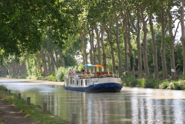 The 6-passenger Clair de Lune, cruising the Canal du Midi, is one of the most romantic ways to travel along the canal and through the countryside.