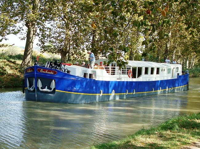 The 8-passenger ultra-deluxe Enchante, cruising on the historic 350-year-old Canal du Midi in the South of France.