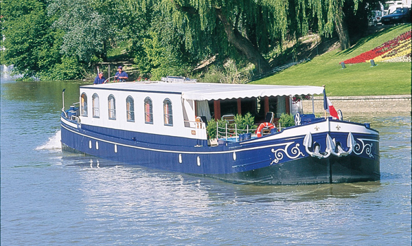 The 6-passenger ultra deluxe Hotel Barge Fleur de Lys, cruises in Burgundy.
