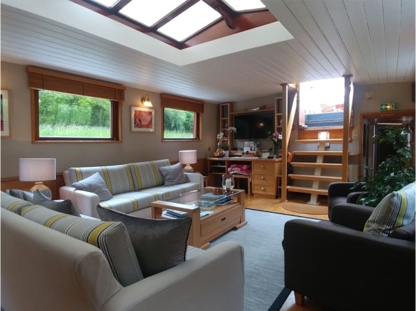The comfortable and roomy salon aboard the Hirondelle
with large picture windows<br> offers plenty of room to relax