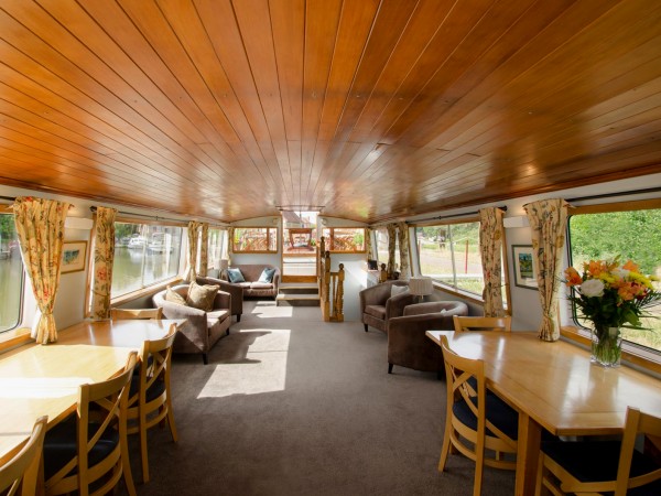 The comfortable salon with large picture
windows aboard the Luciole