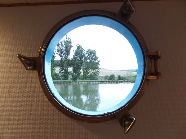 The unique view of the Canal de Bourgogne from your
cabin's
porthole.