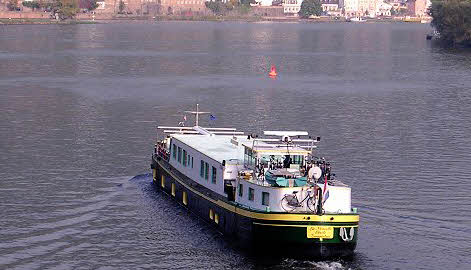 The Hotel-Barge Nouvelle Etoile, cruising on the beautiful Mosel River in Germany.  The ultra-deluxe hotel barge Nouvelle Etoile cruises in Holland in the spring (Tulip Cruises), then cruises in France in Burgundy and Champagne in mid-season, and in Alsace and Germany in the Fall.  Nouvelle Etoile is one of more than 60 luxury barges in Europe and offers one of the most pampered cruises in Europe with exceptional cuisine, wines, and owner-hosts and professional crew to create an exquisite week and a lifetime memory.  Go barging on the canals of Holland and rivers of France and Germany for the vacation and holiday experience of a lifetime!
