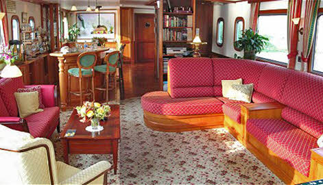 There is ample space for lounging inside and on the deck, and a lovely area for the cocktail hour and 'al fresco' eating.