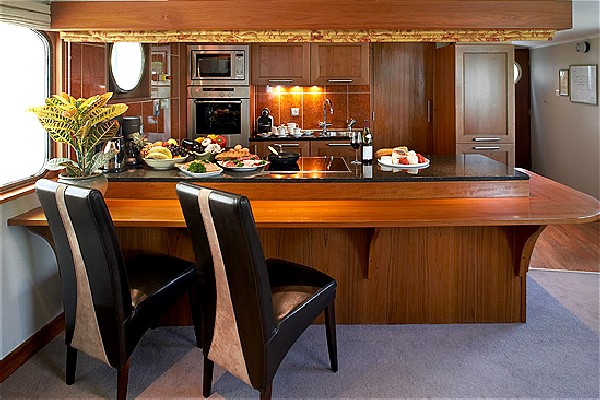 The open kitchen aboard the Prosperite is a great place
to watch
your talented chef<br> prepare your delicious meals