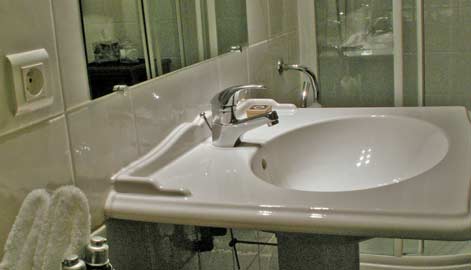The bath in each cabin aboard the Renaissance features two washbasins, large shower, and commode.