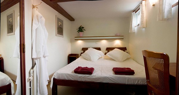One of the three cabins aboard the Saint Louis, each with twin beds or oversized double bed, including ensuite tiled bathroom with large shower.
