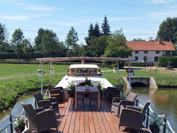 The spacious and partially canopied sundeck
aboard the Saroche offers a wonderful space<br> to relax and enjoy the passing
vistas or an alfresco meal