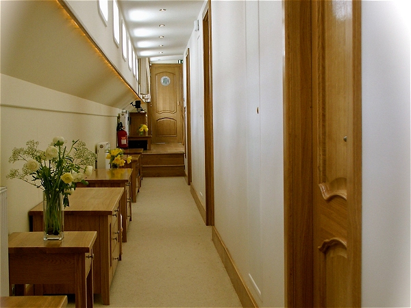 The well lit hallway leading to your cabin.