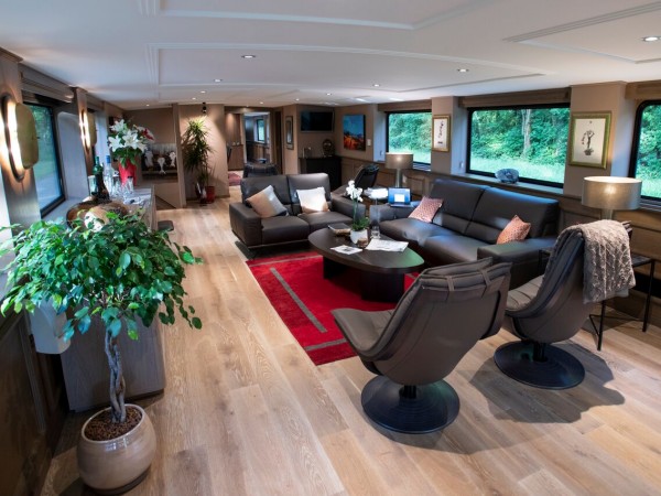 The elegant contemporary salon aboard the Grand Cru with
large picture windows throughout