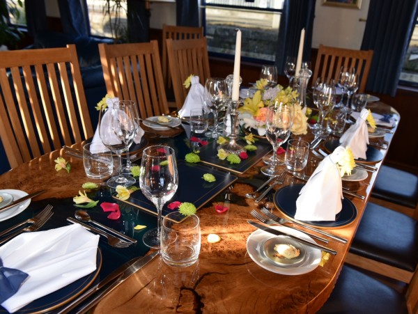 The lovely
dining
table is always beautifully set for every meal