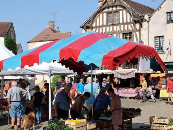 An open market in the quaint village of Noyers