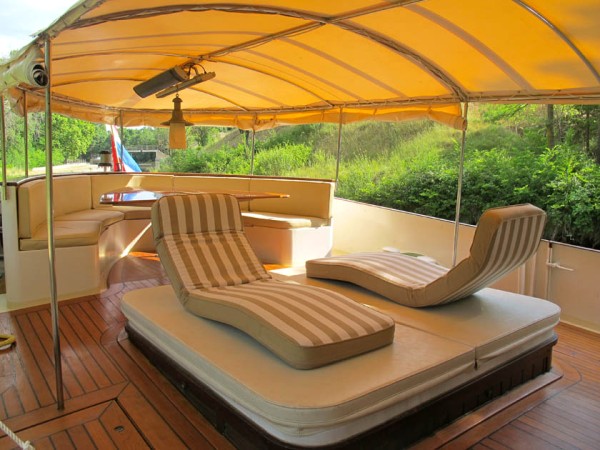 The aft deck offers alfresco dining,
comfortable loungers and a spa pool shown above and below