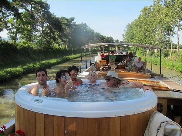 Relax in the spa pool aboard the Tango while cruising